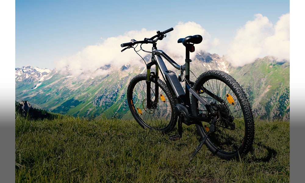 The picture shows a mountain bike in the mountains.
