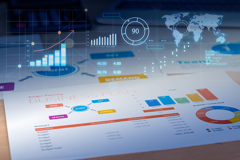 Business plan with financial graph and future growth glowing diagram and laptop at background