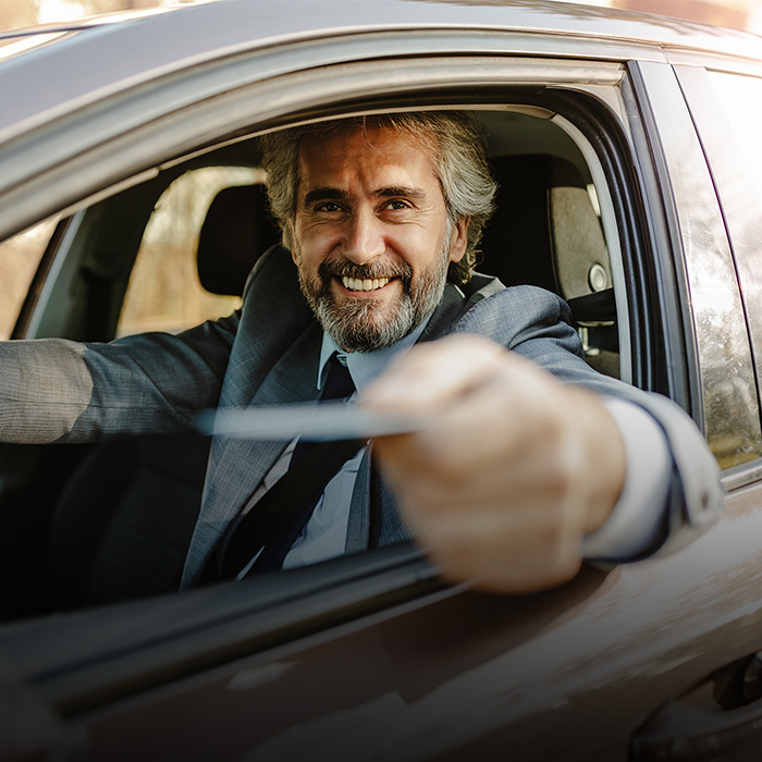 Ticket Based Parking Person holding parking ticket in Car